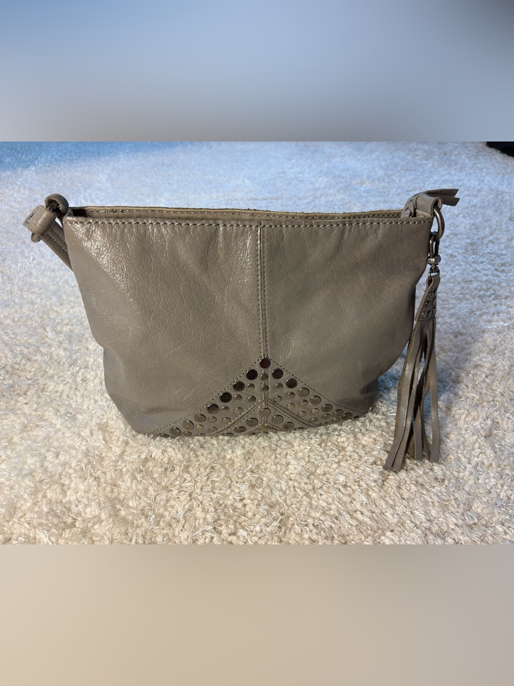 The Sak Grey Leather Hobo with Studded Accent and Tassel